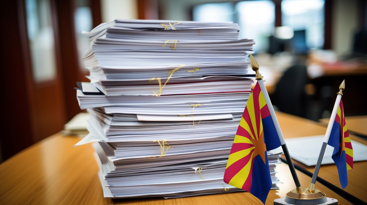 Business documents stacked on office desk
